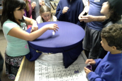 Children experimenting with the gravity well