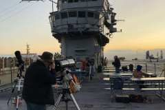 Docent on the USS Hornet with a telescope
