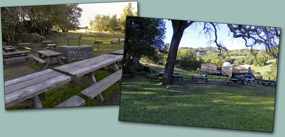 RFO campground area featuring a campfire area surrounded by picnic tables. Beside the area is an open area for tents.