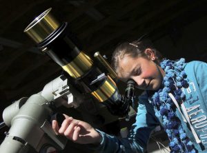 Girl using solar scope during RFO class.