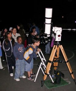 kids looking through telescope